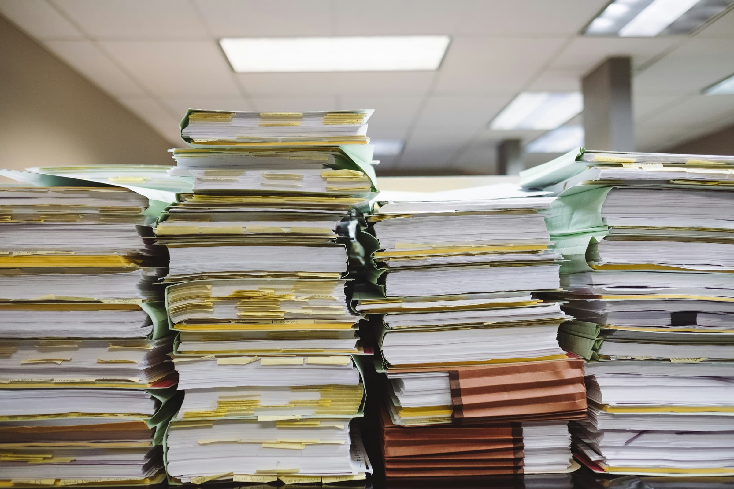 A stack of folders and files.